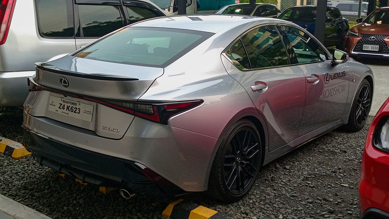 Rear three-quarter view of a 2023 Lexus IS 350 F Sport in Sonic Iridium